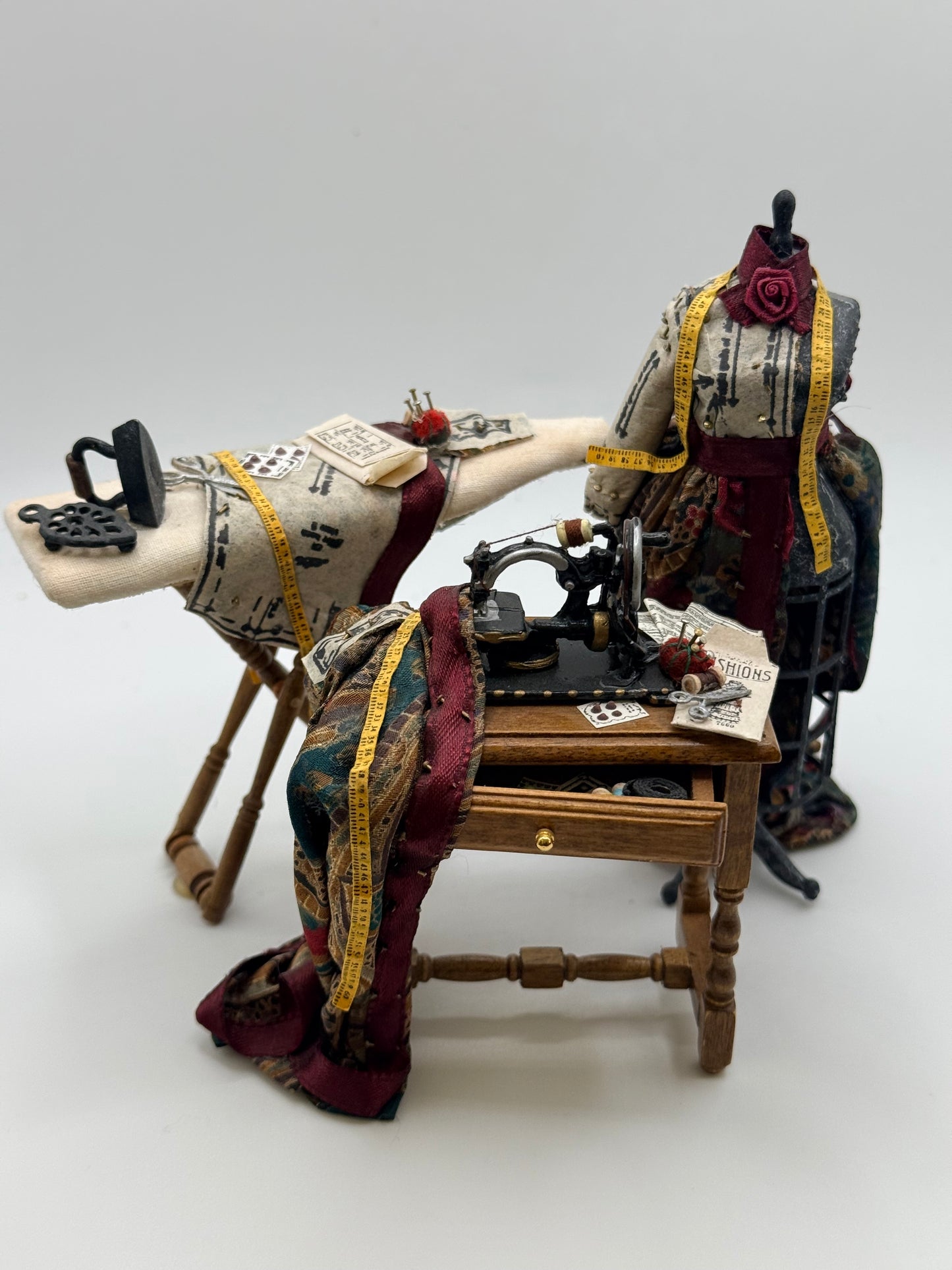 Sewing Machine, Mannequin, and Ironing board