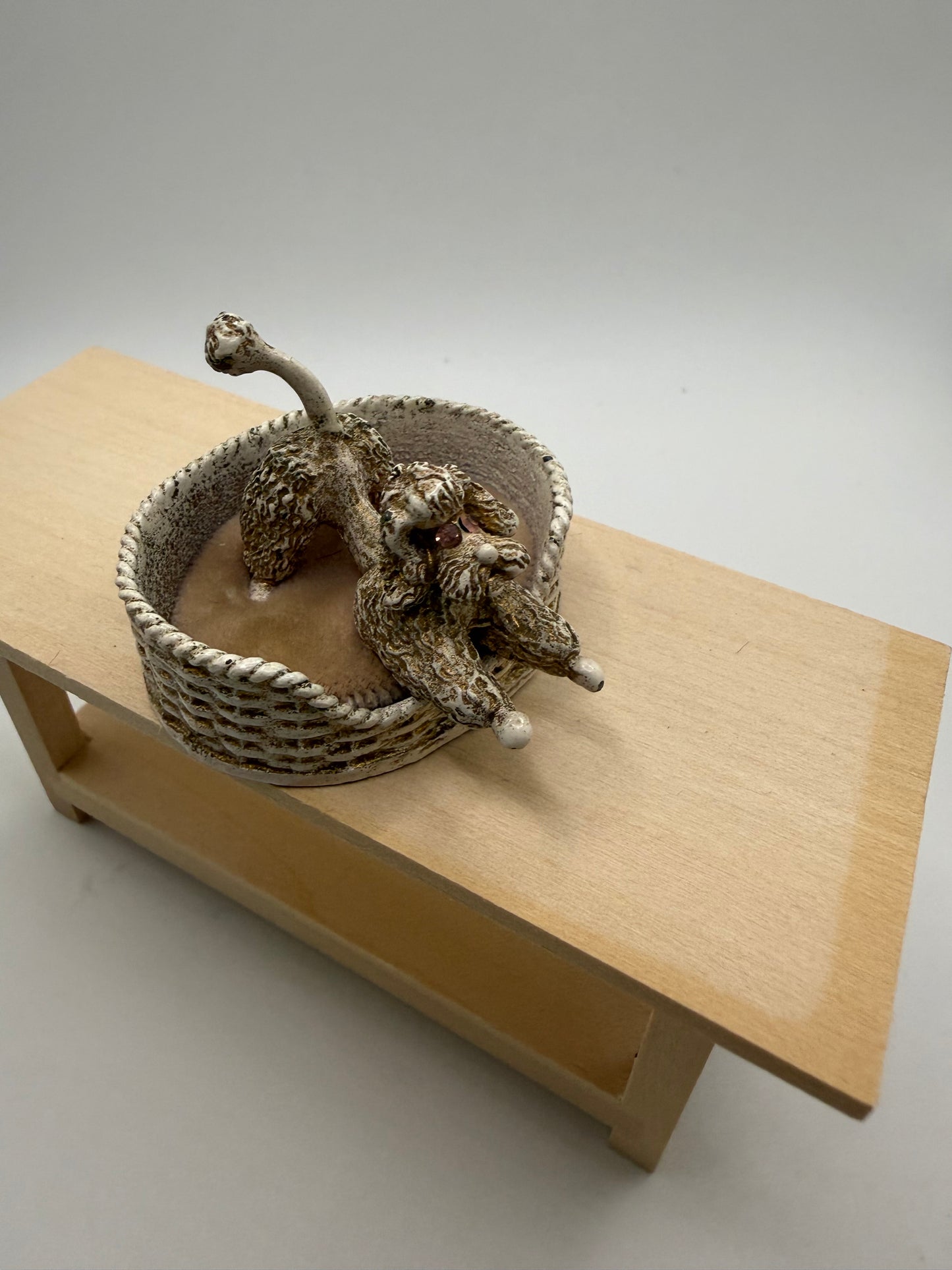 Metal Poodle in bed