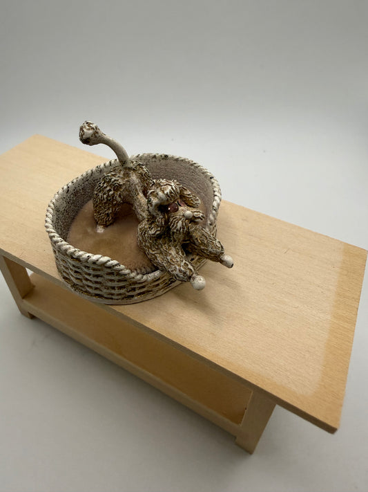 Metal Poodle in bed