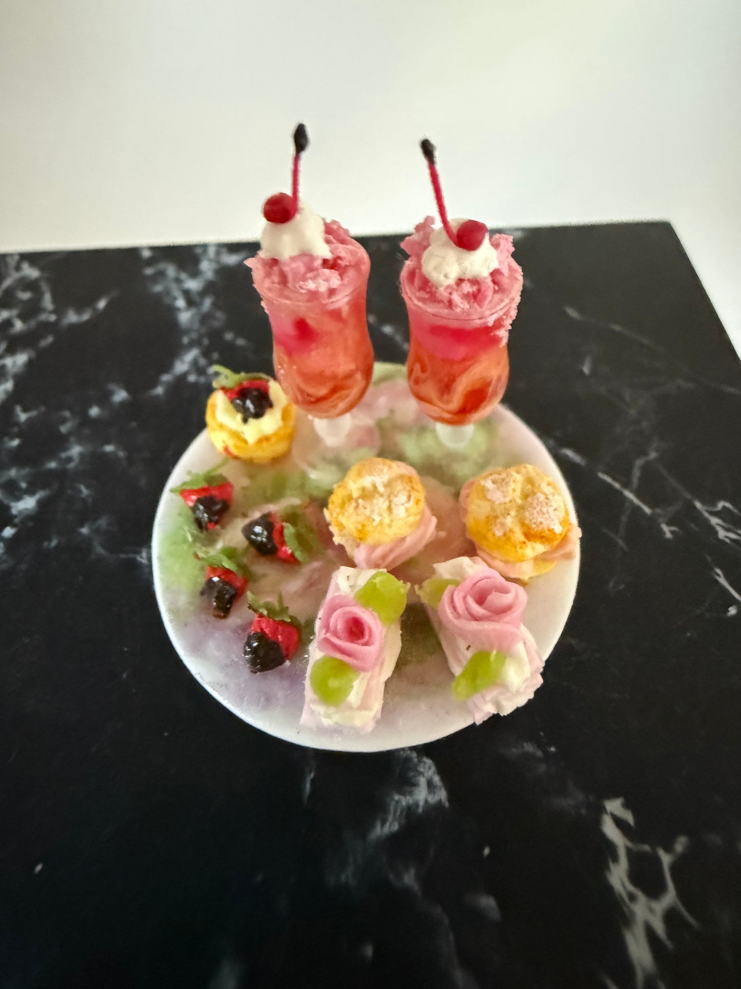 Round plate with parfait glasses and Pastries